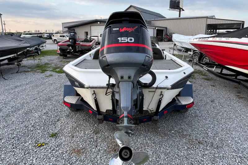 Slide: The Image of 2003 Champion 187 CX boat with Yamaha VMAX 150 engine on gravel lot. - 8