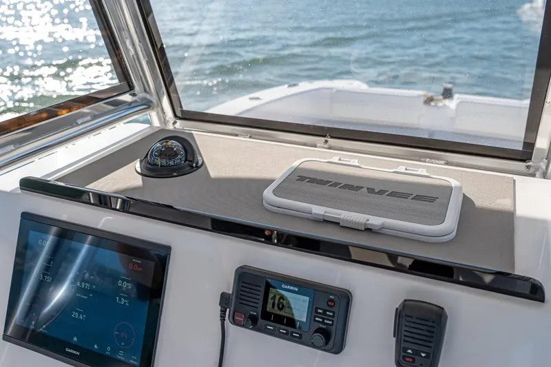 Slide: The Image of Dashboard of Twin Vee 260 STX CC 2026 with navigation equipment. - 11