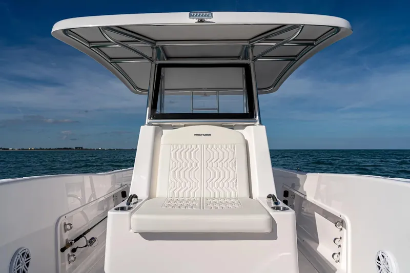 Slide: The Image of 2026 Twin Vee 260 STX CC boat on open sea. - 14