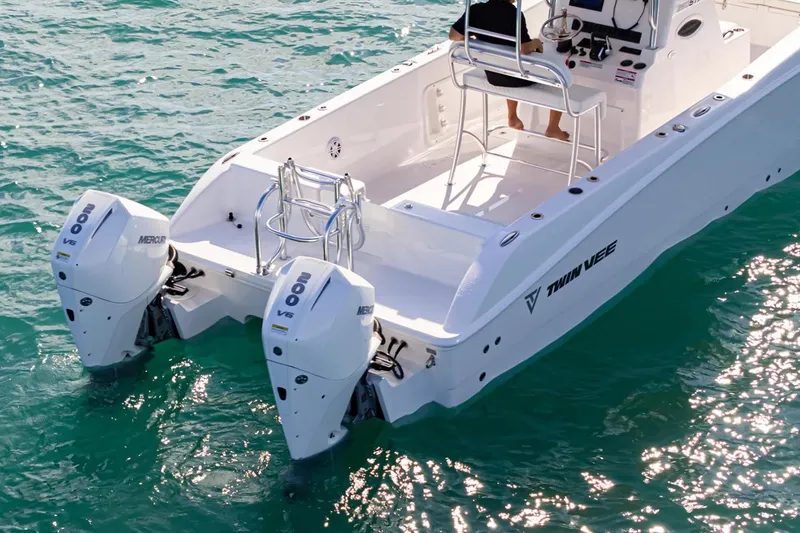 Slide: The Image of Manufacturer Provided Image: 2026 Twin Vee 260 STX CC boat with dual Mercury 200 V6 engines on clear water. - 5