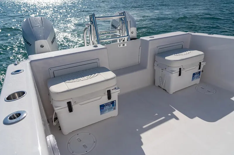 Slide: The Image of Manufacturer Provided Image: 2026 Twin Vee 260 STX CC boat deck with coolers and Mercury engines. - 6
