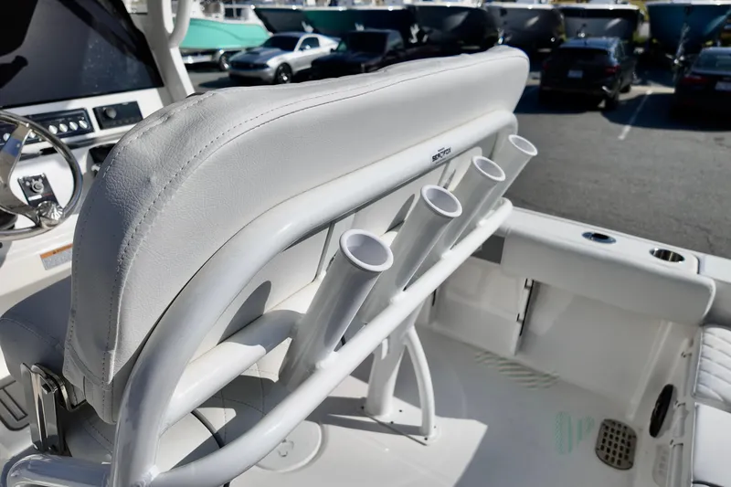 Slide: The Image of 2026 Sea Fox 228 Commander boat interior with rod holders and white seating. - 10