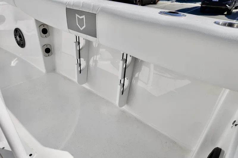 Slide: The Image of 2026 Sea Fox 228 Commander boat interior with rod holders and speaker. - 14