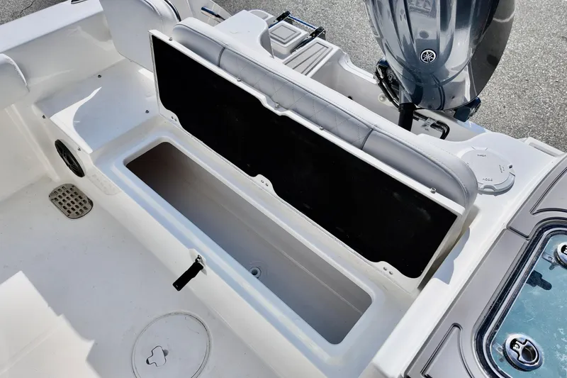 Slide: The Image of 2026 Sea Fox 228 Commander boat interior with open storage compartment and Yamaha engine. - 16