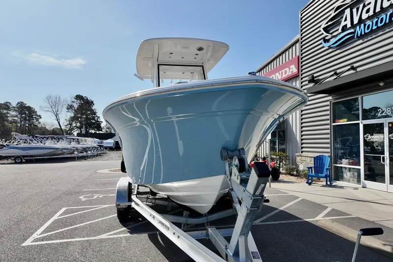 Slide: The Image of 2026 Sea Fox 228 Commander boat on trailer outside dealership. - 2