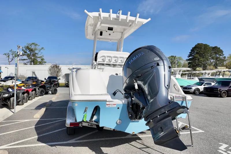 Slide: The Image of 2026 Sea Fox 228 Commander boat with Yamaha outboard motor in a parking lot. - 3