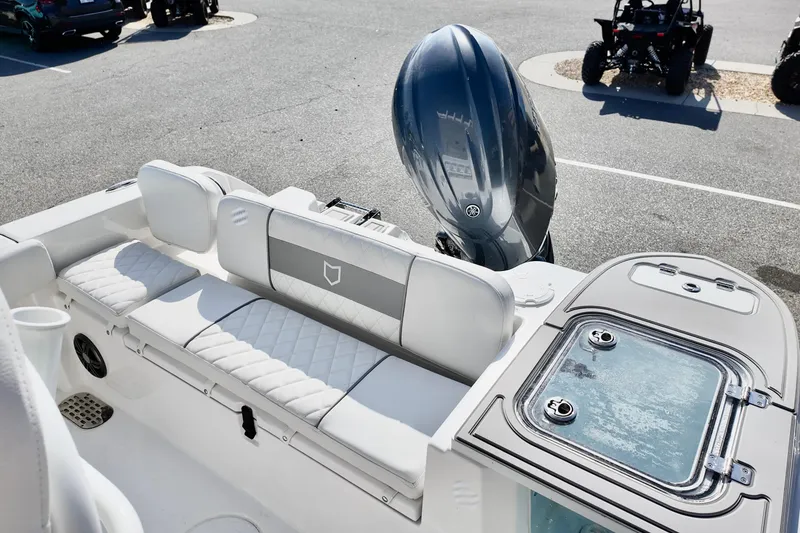 Slide: The Image of 2026 Sea Fox 228 Commander boat interior with seating and engine view. - 8