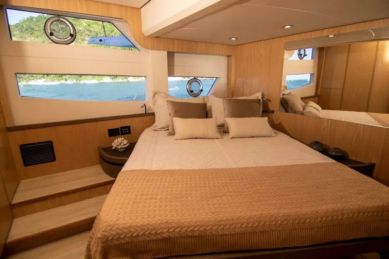 Slide: The Image of Luxurious bedroom interior of 2025 OKEAN 52 yacht with ocean view windows. - 11