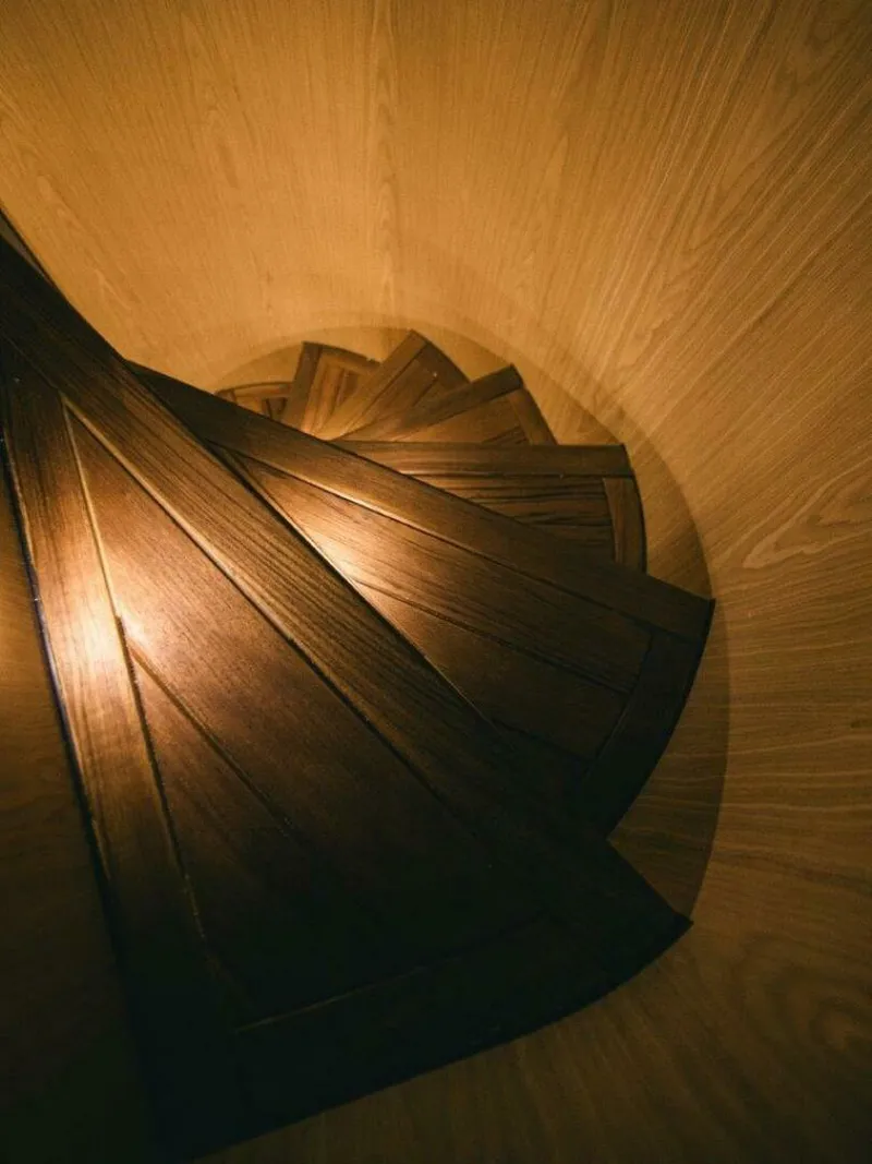 Slide: The Image of Spiral wooden staircase with warm lighting, OKEAN 52, 2025 model. - 12