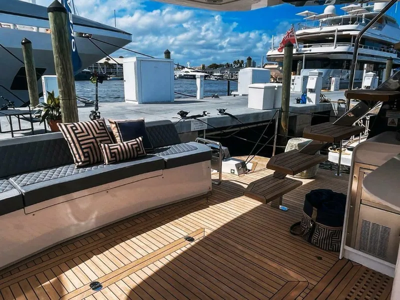 Slide: The Image of Luxurious 2025 OKEAN 52 yacht deck with stylish seating and waterfront view. - 14