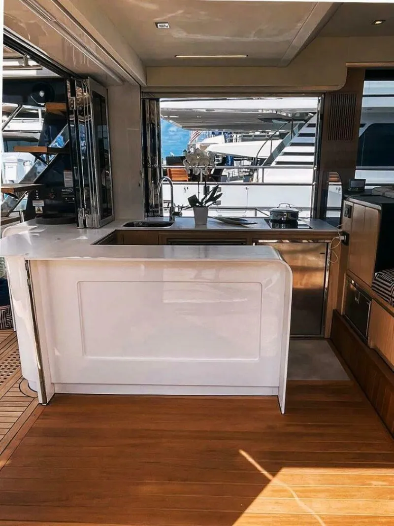 Slide: The Image of Luxurious interior of 2025 OKEAN 52 yacht with modern kitchen and wooden flooring. - 15