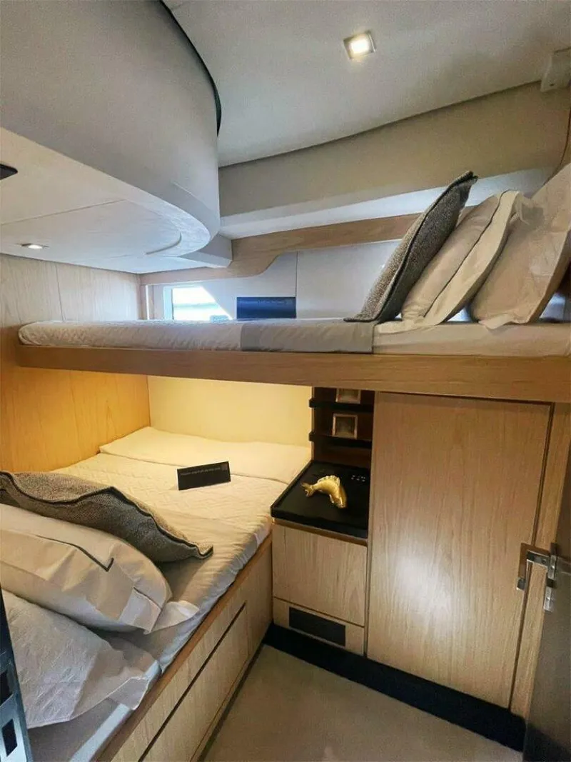 Slide: The Image of Luxurious cabin interior of 2025 OKEAN 52 yacht with modern bunk beds and elegant design. - 18