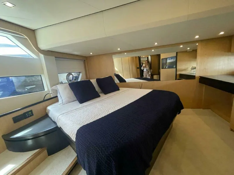 Slide: The Image of Luxurious bedroom interior of 2025 OKEAN 52 yacht with modern design and elegant furnishings. - 19