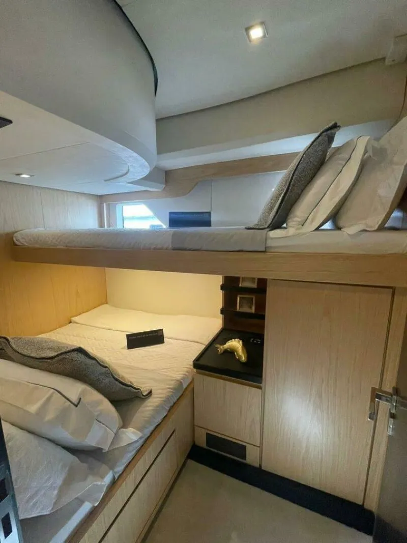 Slide: The Image of Luxurious cabin interior of 2025 OKEAN 52 yacht with modern bedding and sleek design. - 20