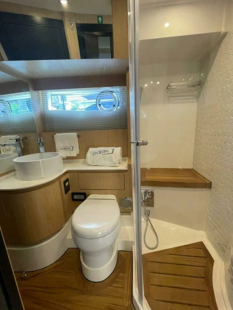 Slide: The Image of Luxury bathroom in 2025 OKEAN 52 yacht with modern fixtures and wooden accents. - 21