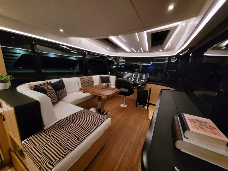 Slide: The Image of Luxurious interior of 2025 OKEAN 52 yacht with modern seating and elegant decor. - 23