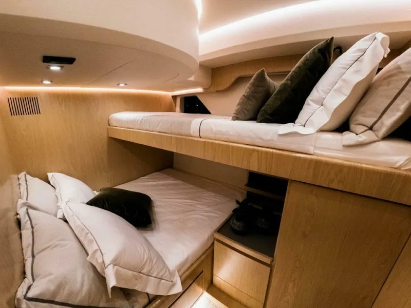 Slide: The Image of Luxurious cabin interior of 2025 OKEAN 52 yacht with cozy bunk beds. - 24