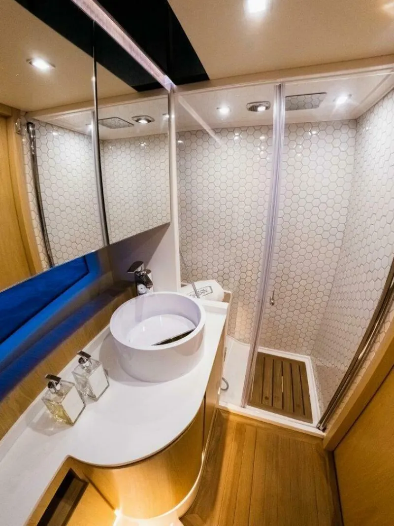 Slide: The Image of Luxurious bathroom in 2025 OKEAN 52 yacht with modern fixtures and elegant design. - 25