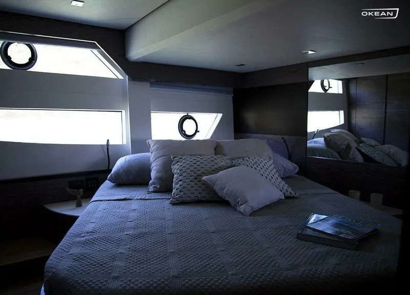 Slide: The Image of Luxurious bedroom interior of 2025 OKEAN 52 yacht with modern design and cozy bedding. - 27