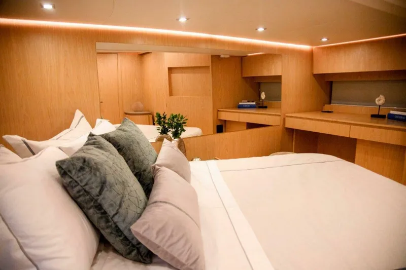 Slide: The Image of Luxurious bedroom interior of 2025 OKEAN 52 yacht, featuring modern design and cozy bedding. - 28