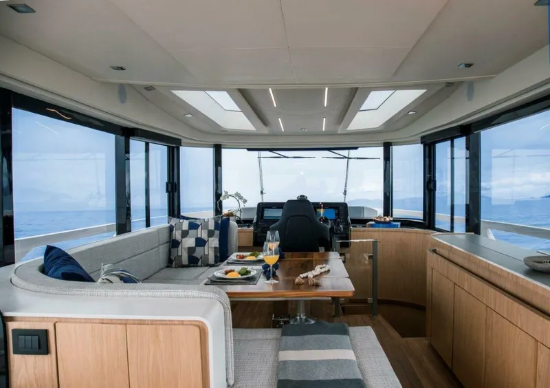 Slide: The Image of Luxurious interior of 2025 OKEAN 52 yacht with panoramic windows and elegant seating. - 31