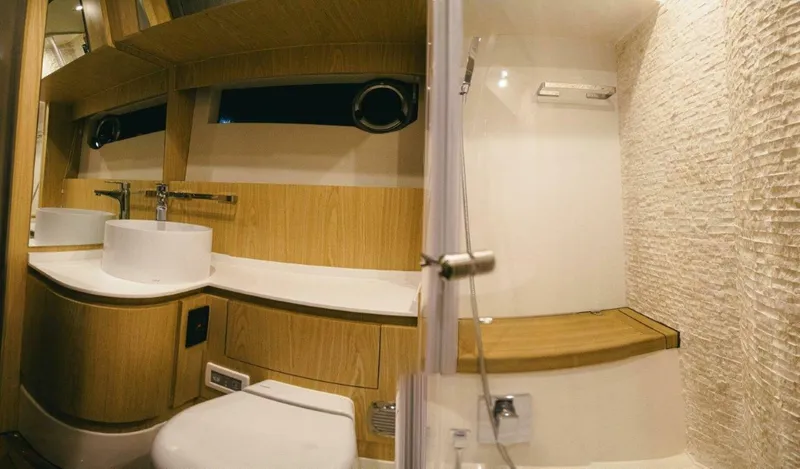 Slide: The Image of Modern bathroom interior in 2025 OKEAN 52 yacht, featuring wood accents and sleek fixtures. - 32