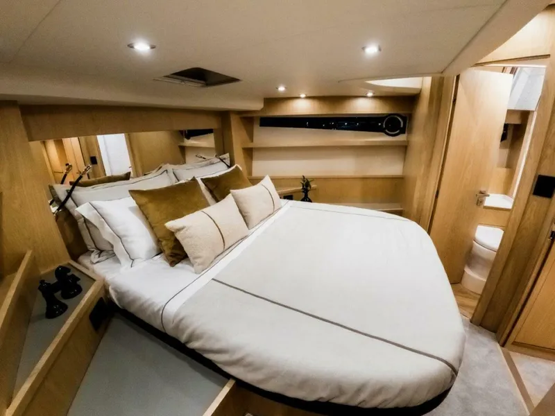 Slide: The Image of Luxurious bedroom interior of 2025 OKEAN 52 yacht with modern design and cozy bedding. - 33