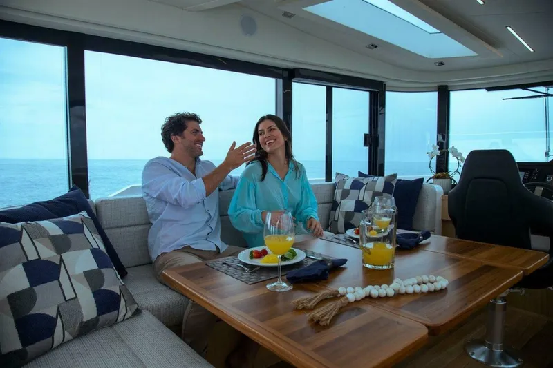 Slide: The Image of Couple enjoying leisure time on OKEAN 52 yacht, 2025 model, with ocean view. - 40