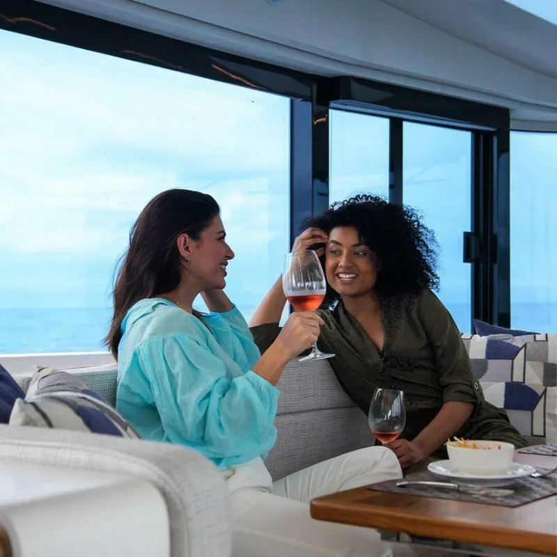 Slide: The Image of Two people enjoying drinks on a luxurious 2025 OKEAN 52 yacht. - 45