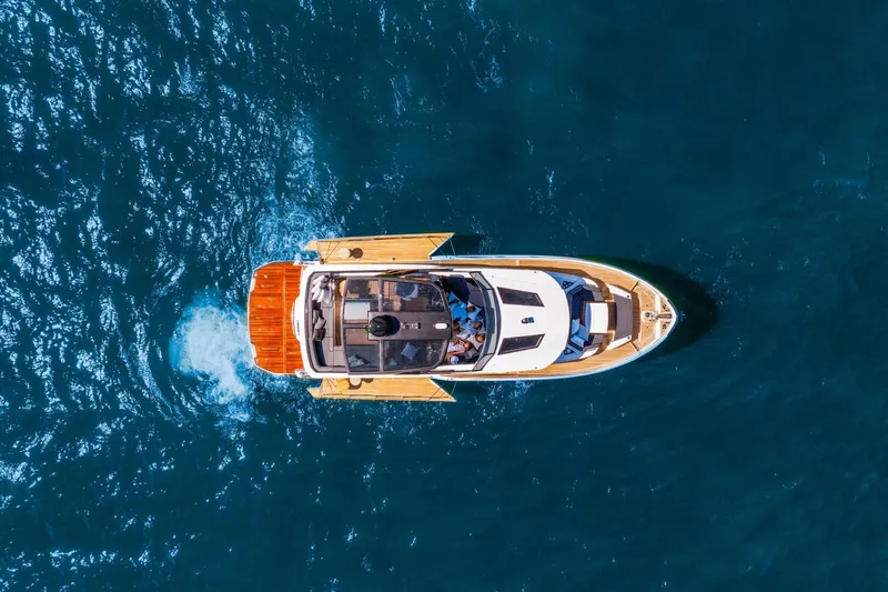 Slide: The Image of Aerial view of 2025 OKEAN 52 yacht cruising on blue ocean waters. - 47