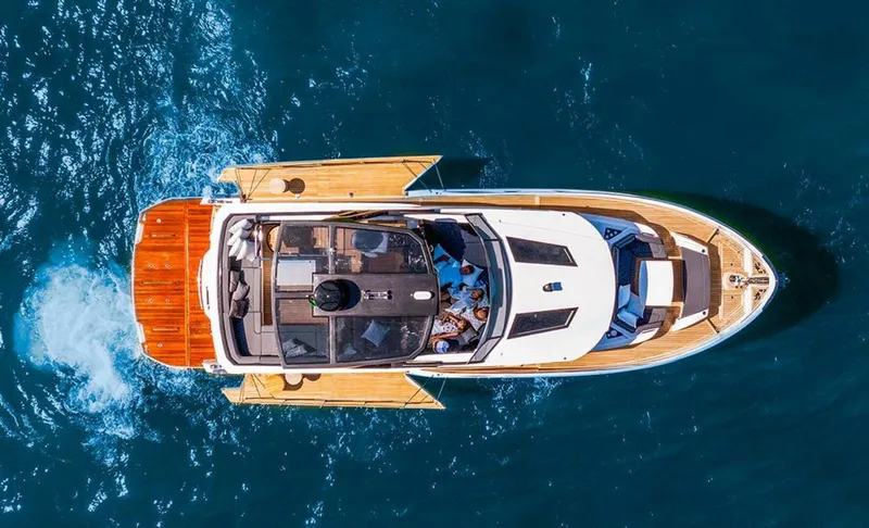 Slide: The Image of Aerial view of 2025 OKEAN 52 yacht cruising on blue ocean waters. - 48