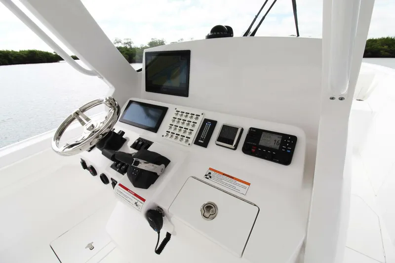 Slide: The Image of 2024 Intrepid 375 Nomad SE helm with advanced navigation and control systems. - 7
