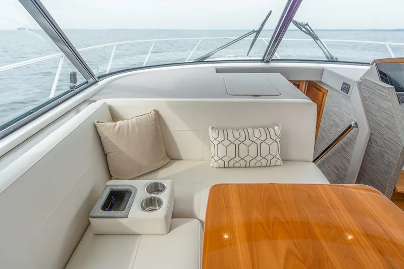 Slide: The Image of Luxurious interior of 2021 Tiara Yachts F44 Flybridge with plush seating and ocean view. - 21