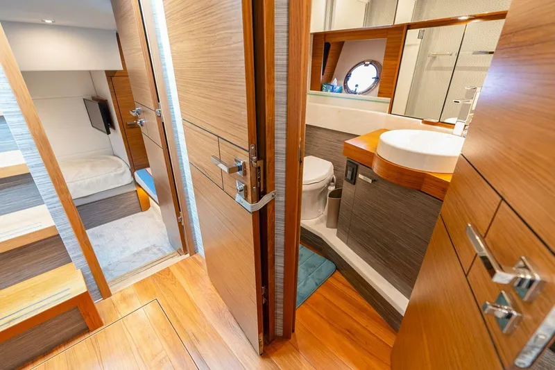 Slide: The Image of Luxurious interior of 2021 Tiara Yachts F44 Flybridge, featuring a modern bathroom and cozy cabin. - 33