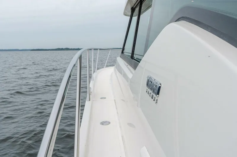Slide: The Image of 2021 Tiara Yachts F44 Flybridge on open water, showcasing sleek design and craftsmanship. - 43