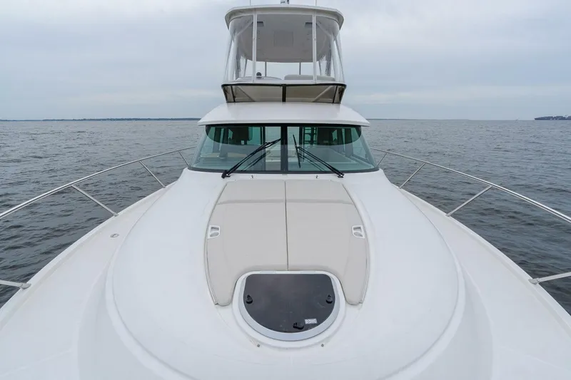 Slide: The Image of 2021 Tiara Yachts F44 Flybridge on open water, showcasing sleek design and spacious deck. - 45