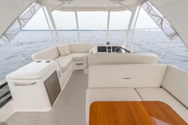 Slide: The Image of Luxurious interior of 2021 Tiara Yachts F44 Flybridge with elegant seating and ocean view. - 48