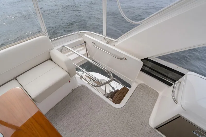 Slide: The Image of 2021 Tiara Yachts F44 Flybridge interior with seating and ocean view. - 54