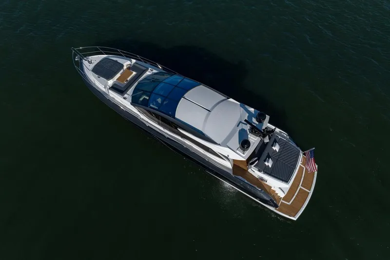 Slide: The Image of Aerial view of 2020 Sunseeker Predator 74 yacht cruising on open water. - 1