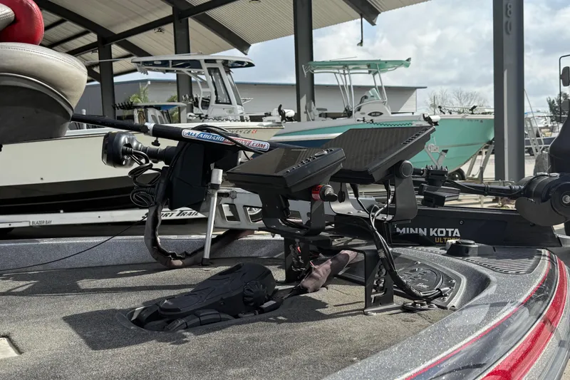 Slide: The Image of 2011 Ranger 521SVX Comanche boat with Minn Kota trolling motor in marina setting. - 12