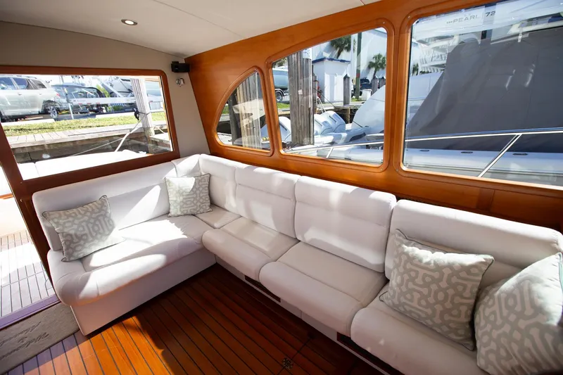 Slide: The Image of Luxurious interior of 2017 Palm Beach PB42 yacht with white seating and wooden accents. - 17