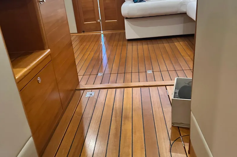 Slide: The Image of Interior of 2017 Palm Beach PB42 yacht with wooden flooring and white seating. - 20