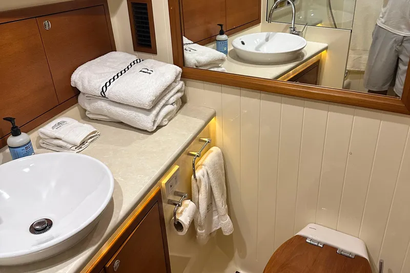 Slide: The Image of Luxurious bathroom in 2017 Palm Beach PB42 yacht with elegant fixtures and plush towels. - 22