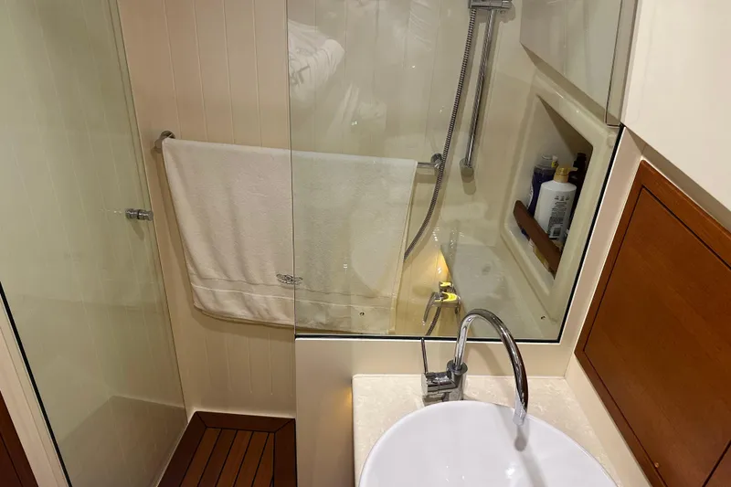 Slide: The Image of Luxurious bathroom in 2017 Palm Beach PB42 yacht with modern fixtures and elegant design. - 24