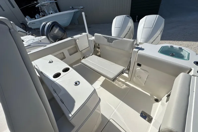 Slide: The Image of 2026 Sailfish 272 CC boat interior with seating and dual Mercury engines. - 11