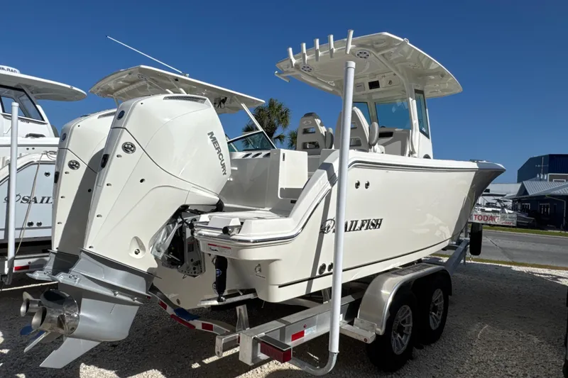 Slide: The Image of 2026 Sailfish 272 CC boat with dual Mercury engines on a trailer. - 3