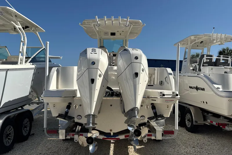 Slide: The Image of 2026 Sailfish 272 CC boat with dual outboard motors, displayed outdoors. - 4