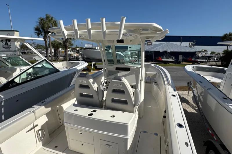 Slide: The Image of 2026 Sailfish 272 CC boat interior with dual seats and center console. - 7