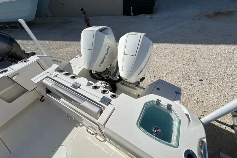 Slide: The Image of 2026 Sailfish 272 CC boat with dual Mercury engines and onboard amenities. - 9