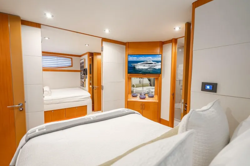 Slide: The Image of Luxurious 2008 Lazzara Motor Yacht bedroom with modern decor and cozy bedding. - 42